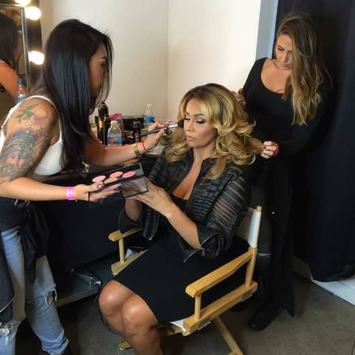 Rebecca Martin, a freelance makeup artist who grew up in Ringwood and now lives in Fair Lawn, puts makeup on Somaya Reece for the filming of Bravo TV’s new reality show, First Family of Hip Hop.