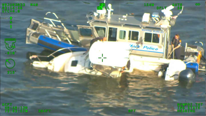 Officers from the Suffolk County Police Marine Bureau rescue an Islip man after he crashed his boat near the Fire Island Pines bulkhead Wednesday, June 8.