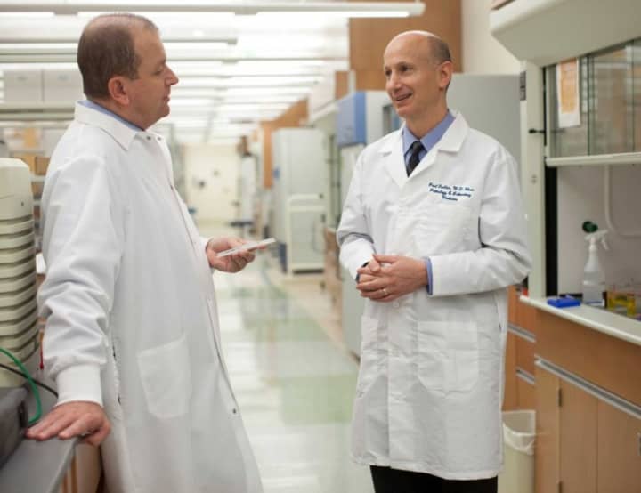 Western Connecticut Health Network doctors Cristiano Ferlini, left, and Paul Fiedler, are two authors of a new study that links a common virus with most cancers. 