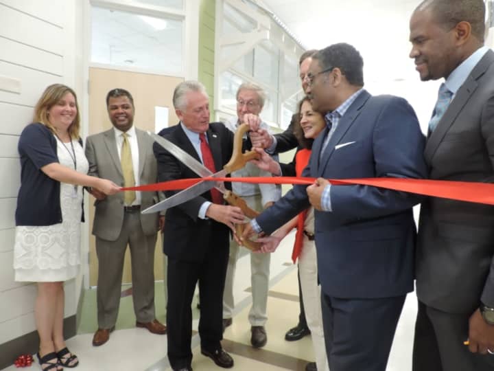 City officials celebrate the opening of the newly renovated Norwalk Early Childhood Center.