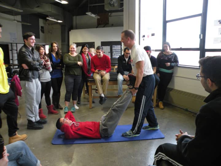 Rich Snedaker demonstrated how to best prepare athletes for events as well as effective ways to stretch out muscle groups and develop optimal range of motion.