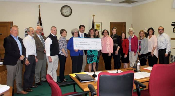 The presentation of the funds to local charities.
