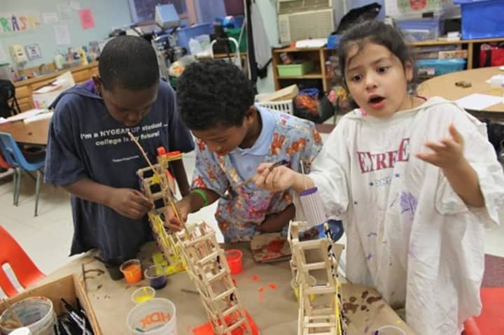 Children make objects out of ice pop sticks at the Ramapo After School Program (RASP) at the Kakiat Elementary School in Spring Valley. The struggling program is on hold while it and East Ramapo school officials work out financial and space issues.