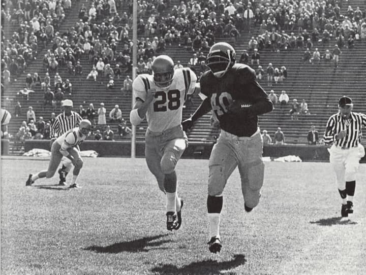 Ron Johnson was a record-setting halfback at the University of Michigan. In this 1967 game against Navy, he rushed for 270 yards.