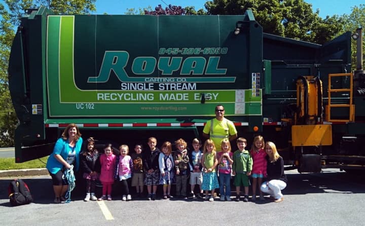 &quot;Driver Rob&quot; brought his Royal Carting truck to Acorns to Oaks Early Childhood Academy for a touch-a-truck event. The company is pairing with the local Chamber of Commerce for an e-recycling event next week.