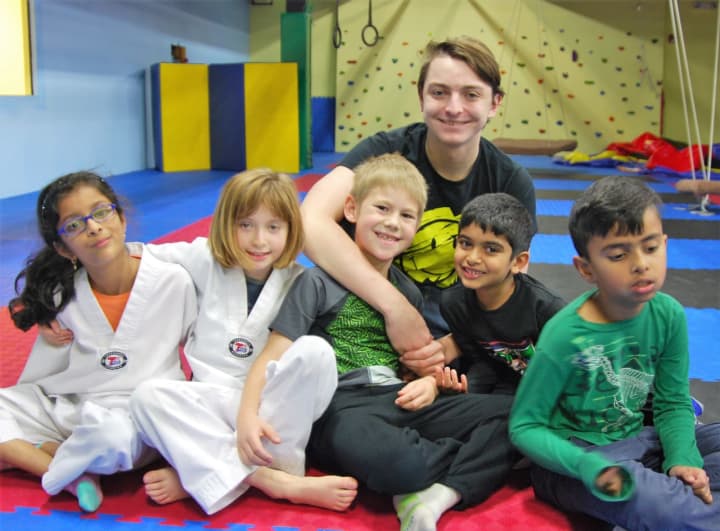 Ryan Kennedy poses with some of his students at Sensory Taekwon-Do in Waldwick.