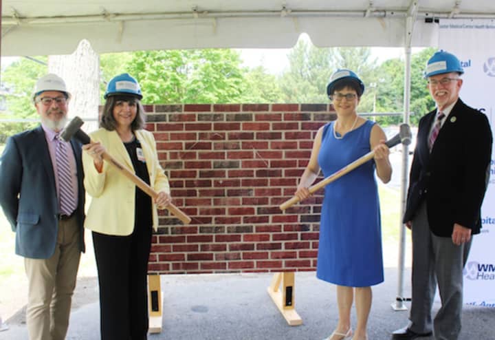 Mary Leahy, MD, CEO, Bon Secours Charity Health System (left) and Mary Juliano, Chair of the Bon Secours Warwick Foundation Board, smash the ceremonial wall to kick off construction of the St. Anthony Community Hospital Radiology Department expansion