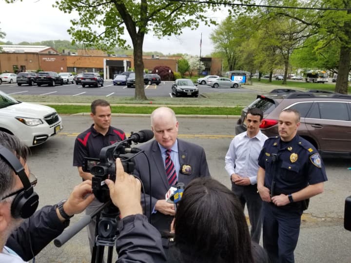Morris County Sheriff James M. Gannon, accompanied by Denville Police Capt. Jeffrey Tucker on his right, addresses the media outside of Morris County Vocational School of Technology Friday.