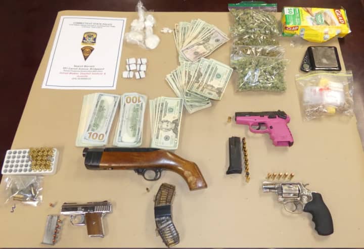 Some of the drugs and guns seized during a search of a Bridgeport home.