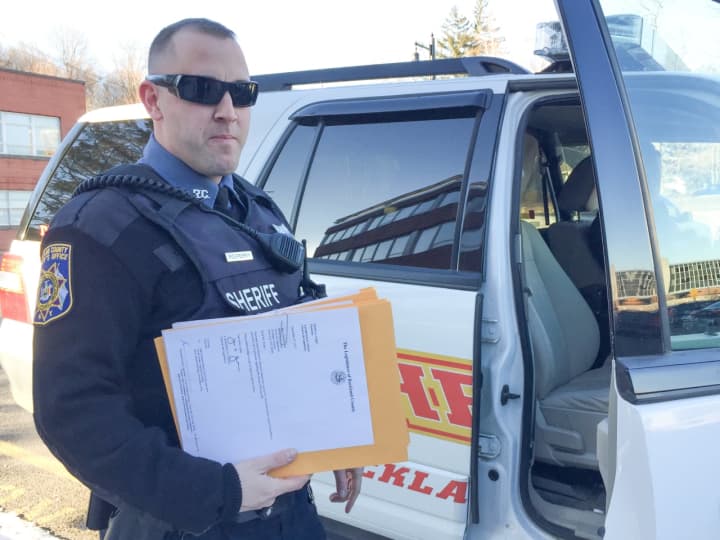 Rockland County Sheriff&#x27;s Officer Steven Perry prepares to deliver the 2018 tax warrants to Rockland&#x27;s five towns.