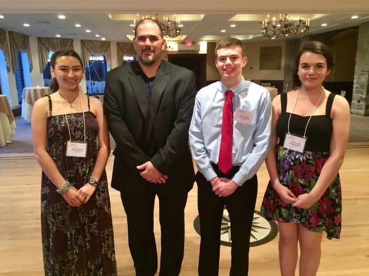 Chris Graziano (second left), vice president of SUEZ operations in New York, with SUEZ-NAWC scholarship winners Jessica Minker of North Rockland High School, Daniel Henry of Tappan Zee High School and Caitlin Holt of Pearl River High School.