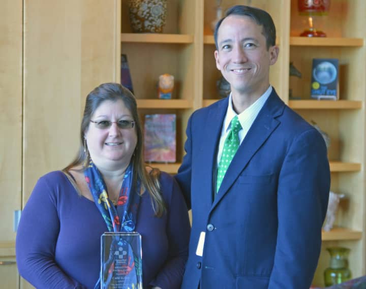 <p>Cathi Kellett receives congratulations from Griffin Hospital Vice President of Accountable Care and General Counsel Todd Liu after being named Advocate of the Year by Safe Kids Connecticut.</p>