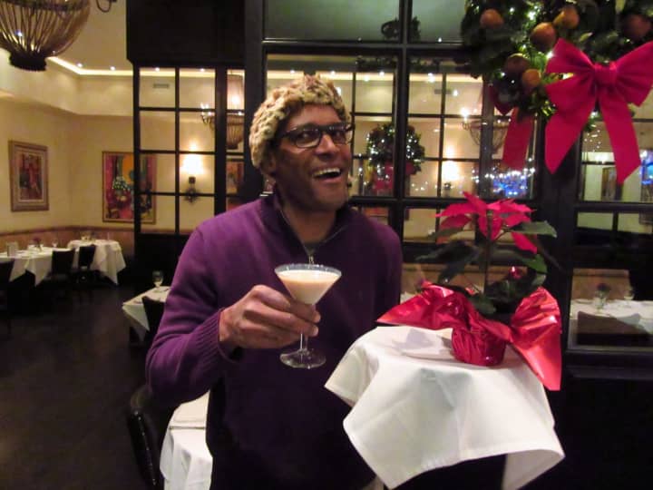 Alvin Clayton, owner of Alvin &amp; Friends in New Rochelle, gets into the holiday spirit with the eatery&#x27;s Cinnamon Crunch cocktail.