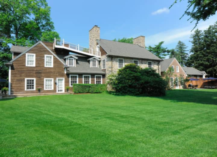 The North Stamford residence, sited on 2.6 acres, boasts a meticulous renovation while still maintaining many original features and antique qualities.