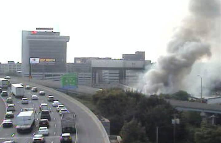 Smoke is visible from I-95 near Pembroke Street in Bridgeport due to a fire in an empty factory. 