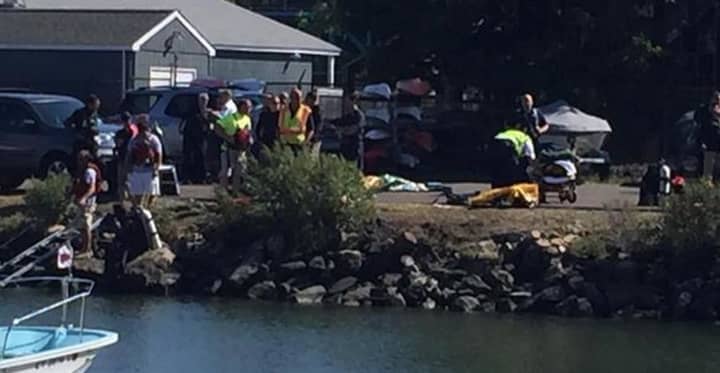 First responders work at the scene of a fatal accident at Cos Cob Harbor in Greenwich on Monday. 