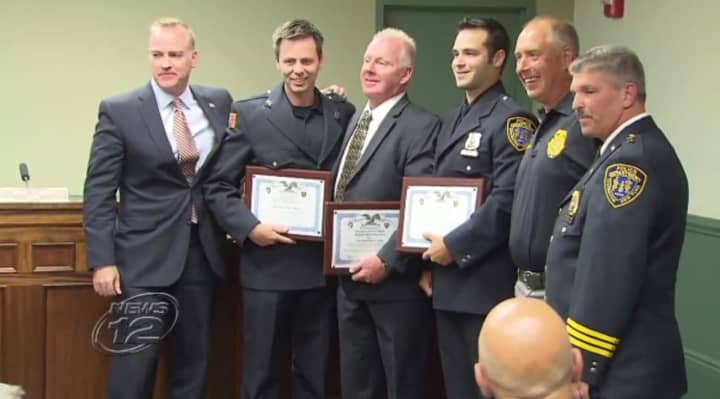 Three Irvington Police officers and the Irvington Fire Chief were honored for helping to stop a domestic dispute in April. 