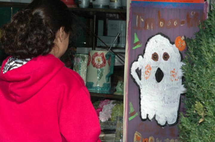 Children have been painting spooky images on Scarsdale storefronts at Halloween for several years.