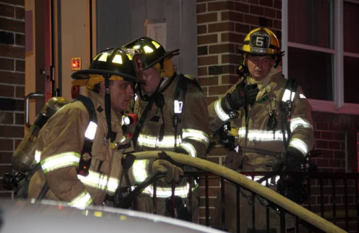 Stamford firefighters respond to a fire at 637 Cove Road in Stamford on Sunday night.