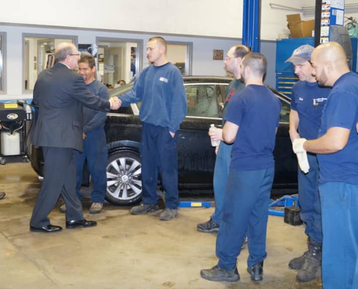 <p>State Sen. Kevin Kelly shakes hands with workers in the service center at Curtiss Ryan Honda in Shelton.</p>