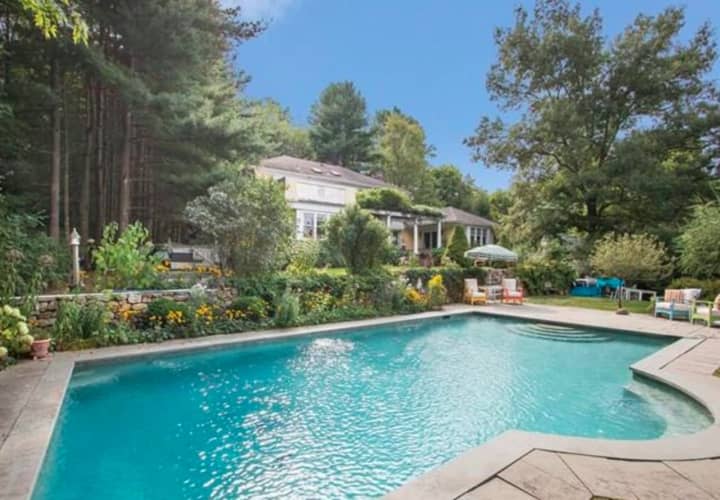 The home at 266 Umpawaug Road in Redding features a gorgeous in-ground pool.