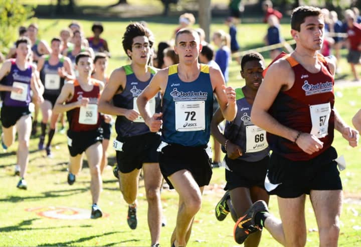 Eric van der Els, a senior from Brien McMahon in Norwalk (no. 55) makes his move late in Saturday&#x27;s Foot Locker national cross country championships in San Diego. 