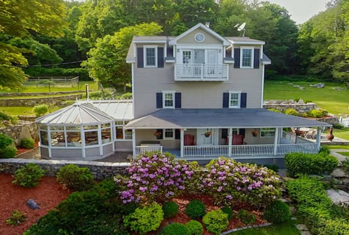 A three-bedroom mini-estate at 121 Maple Road in Brewster also includes more than 9 acres.