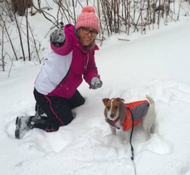 Paula Anger with her dog Lucky enjoying the snow in Stamford during last month&#x27;s big storm.