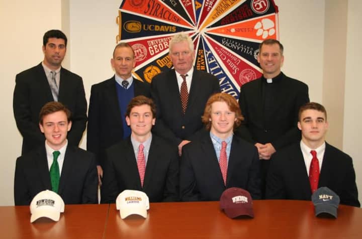 The four seniors from Fairfield Prep moving on to play college lacrosse sit in front of school administrators and coaches. From left to right: Jack O&#x27;Connor, Brendan Hoffman, Colin Smalkais and Nick Franchuk.