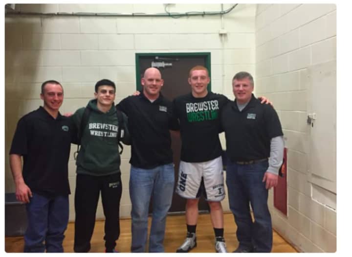 Brewster High School wrestlers Grant Cuomo, second from left, and Michael Larm, second from right.