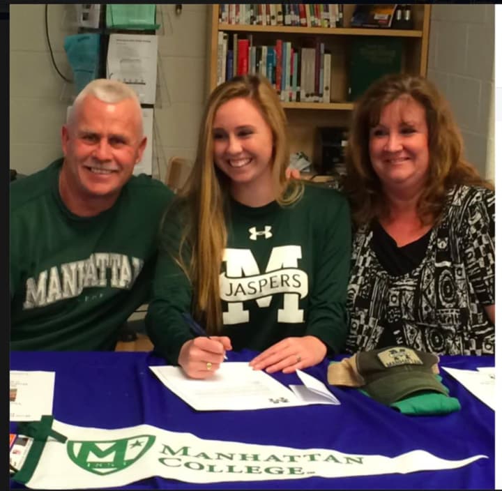 Megan O&#x27;Connor signs commitment letter to play soccer for Manhattan College.