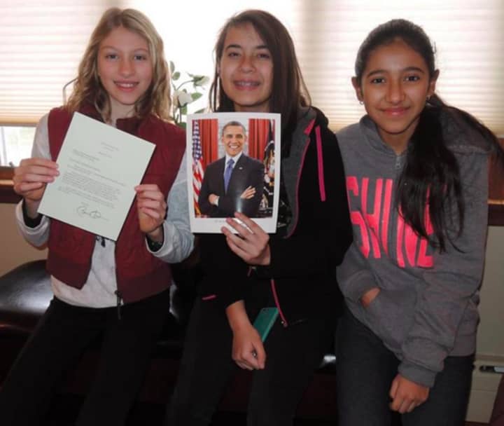 Elizabeth Sagi, Angela Kohout and Madeline Murillo with a signed letter from President Barack Obama.