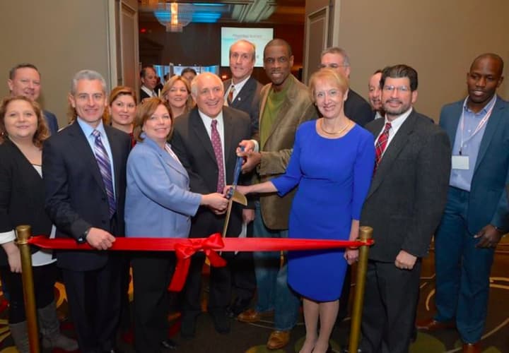 Marsha Gordon (dark blue dress), President and CEO of The Business Council of Westchester, cuts the ribbon at last year&#x27;s event.