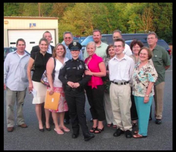 Officer Marsha Lowe and her family after her graduation from the Connecticut Police Academy.