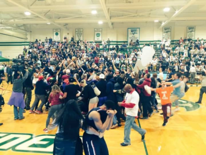 Fairleigh Dickinson students rush the court after the Knights NEC championship victory vs. Wagner.