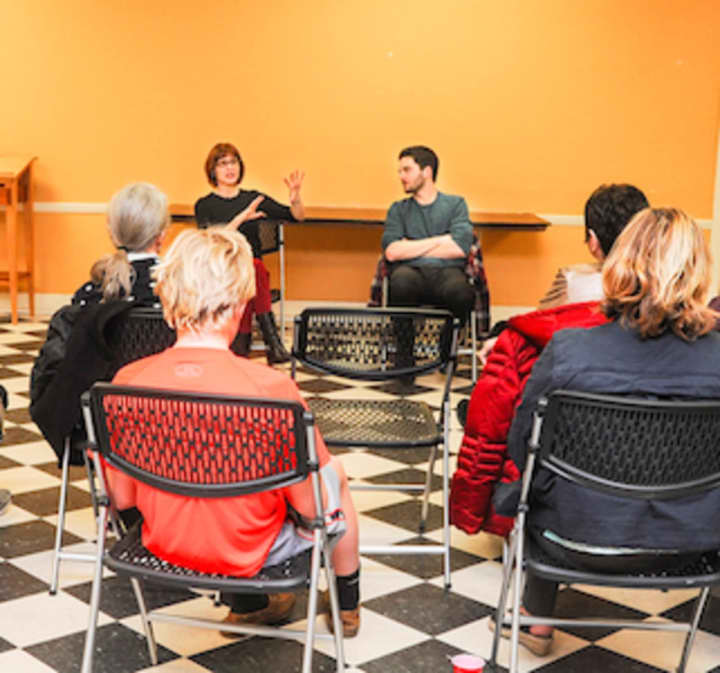 Claire Kelly, director of Shakespeare on the Sound production of “Hamlet” and Joey Santia, who plays the title role, address a group assembled in the Moose Room of the Rowayton Community Center.