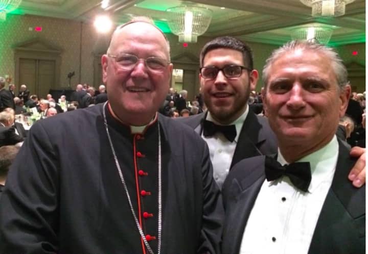 Town of Yorktown Supervisor Michael Grace (r) and son George chatted with New York Archbishop Timothy Cardinal Dolan at the annual fundraising dinner of The Friendly Sons of Saint Patrick of Westchester County, on Friday, March 11, in Rye.