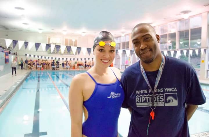 Terrance Ewuell, right, the Aquatics Director at the White Plains YMCA, meets 2008 and 2012 Olympian Chloe Sutton after a recent swim clinic at the Y.