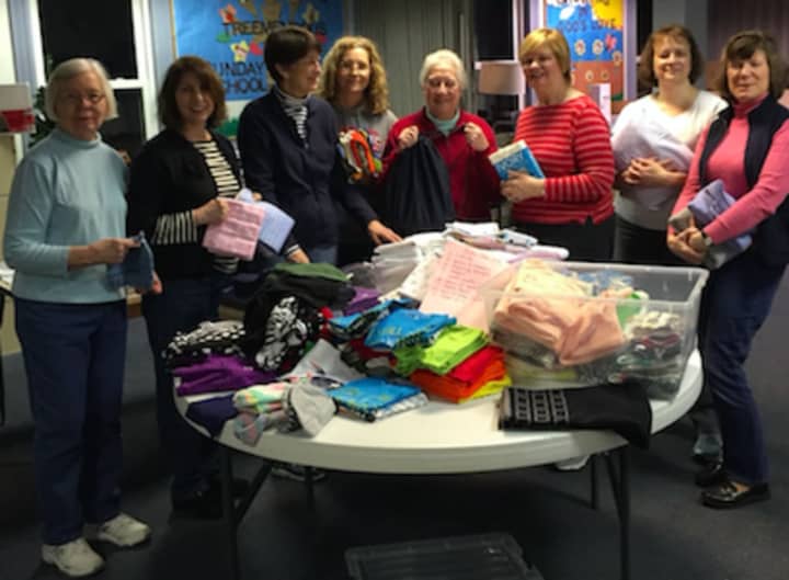 The women of St. Michael&#x27;s Lutheran Church recently made kits for Lutheran World Relief. Pictured (left to right): Evelyn Ness, Laura White, Mary Runestead, Jeannette DiBerardino, Judy Moist, Kathy Mitchell, Sarah Pflueger and Pauline Doenges.