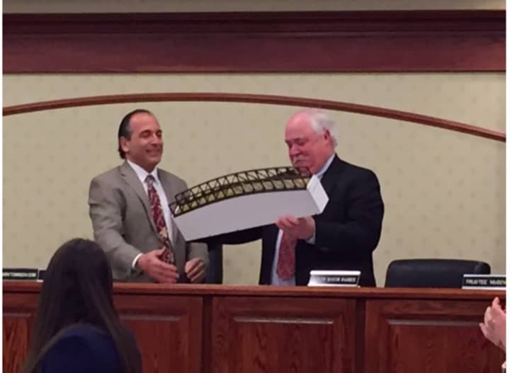 Mayor Fixell presents Tom Basher with a replica of the footbridge.