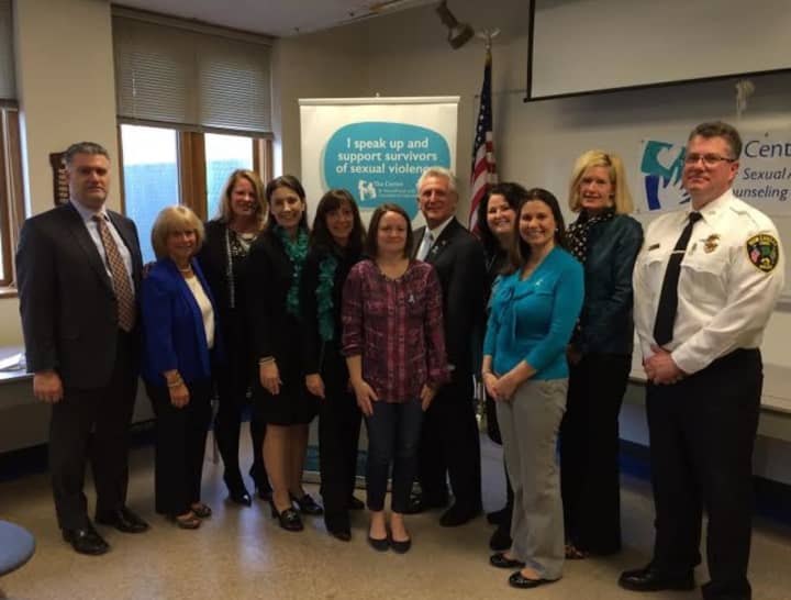 Ivonne Zucco, third from right, Executive Director of The Center in Stamford, helps kick off Sexual Assault Awareness Month on Wednesday in New Canaan. She is joined by other workers from The Center and town leaders.