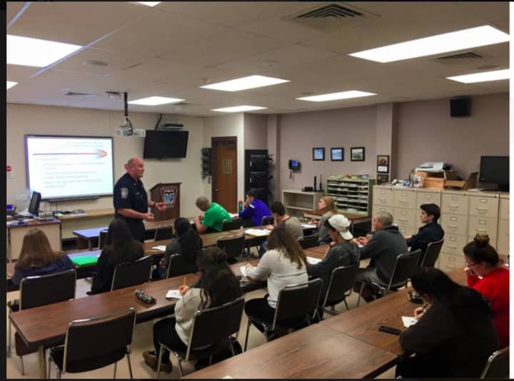 Major James Purcell of the Brookfield Police Department discusses the risks, dangers, consequences and laws surrounding Driving Under the Influence of drugs and/or alcohol with a group of Driver&#x27;s Education students.