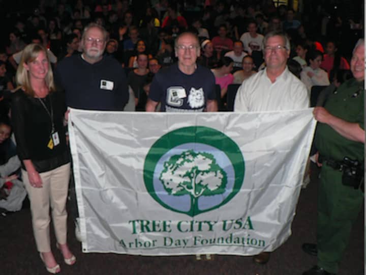 From left, Assistant Principal Laura Maher; Karl Witalis, president emeritus of the land trust; Tony DeCarlo, who provided the seeds from his Newtown orchard; First Selectman Steve Vavrek and Ranger Dave who organized the ceremony.