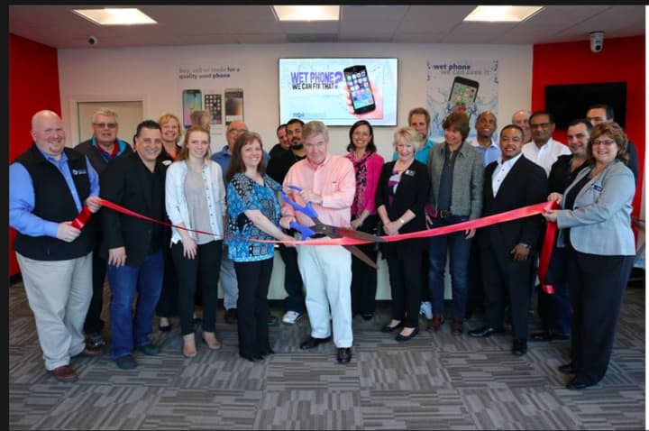 The Brookfield Chamber of Commerce had a ribbon cutting ceremony to celebrate the opening of a new business called The Phone Specialists in Danbury.