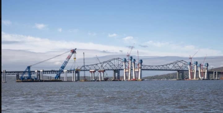 An accident involving an overturned truck Friday on the Tappan Zee Bridge resulted in a baby being born in a nearby parking lot and the delayed arrival of a former president at a rally.