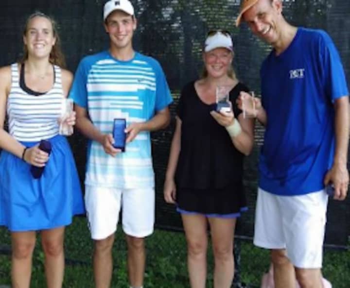 From left to right: Last year’s 76th Fairfield Town Tennis Tournament mixed doubles champions, Caitlin Canella and James Reiss, and runner-ups Pam Reiss and Charles Lipset holding their awards.