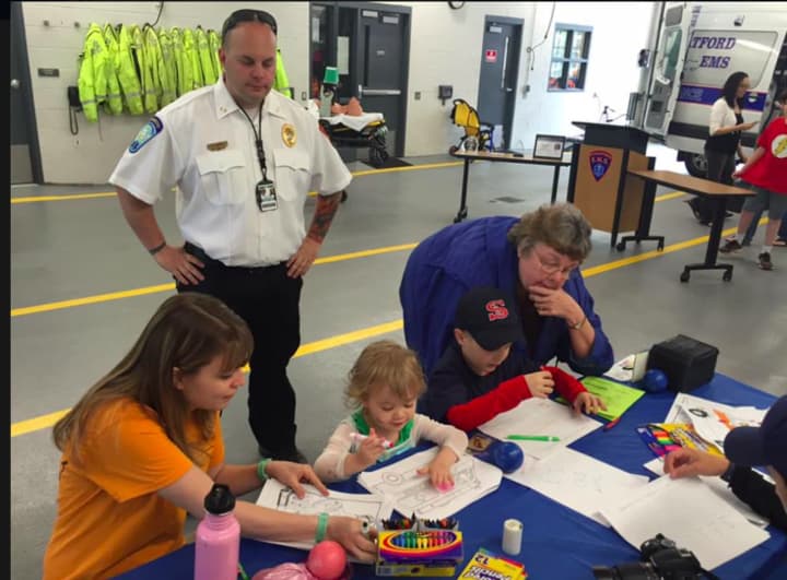 Children color pictures at Stratford EMS&#x27; open house.