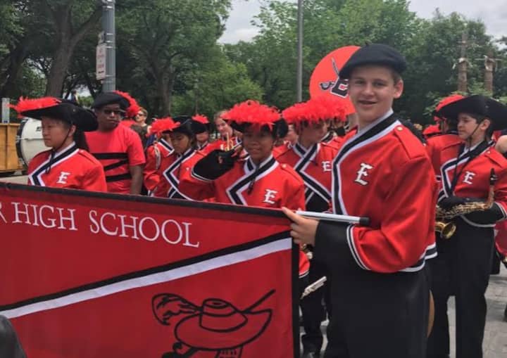 Cole De Magistris, right, holds the Emerson Junior/Senior High School banner in the Memorial Day Parade in Washington D.C. on Monday.
