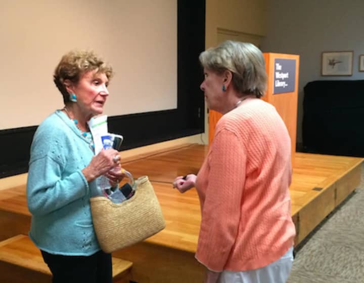 Publishers Weekly Contributing Editor Sybil Steinberg chats with a fellow book lover after revealing her list of summer reads Friday at Westport Library.