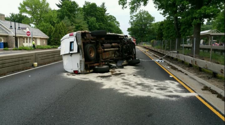 An overturned vehicle closed down the Merritt Parkway near the rest area in Greenwich early Saturday evening.
